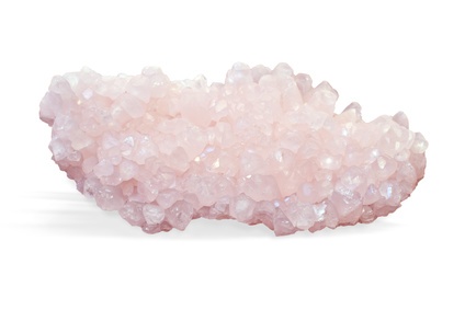 Raw ore of rose quartz crystal isolated on white, closeup of natural mineral on black background.