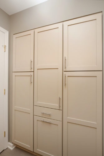 Floor to ceiling storage in bathroom